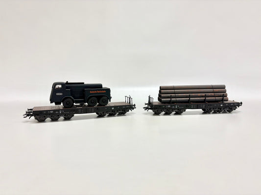 Märklin 2x Schwerlastwagen mit Ladung DR AC H0