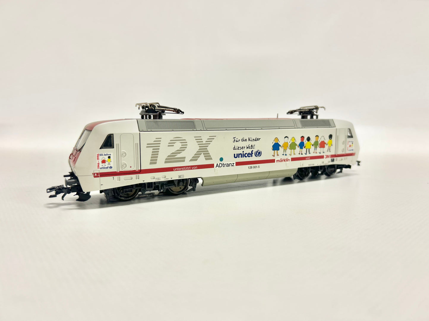 Märklin 37382 Digital E-Lok Br 128 001-5 Unicef DB AC H0