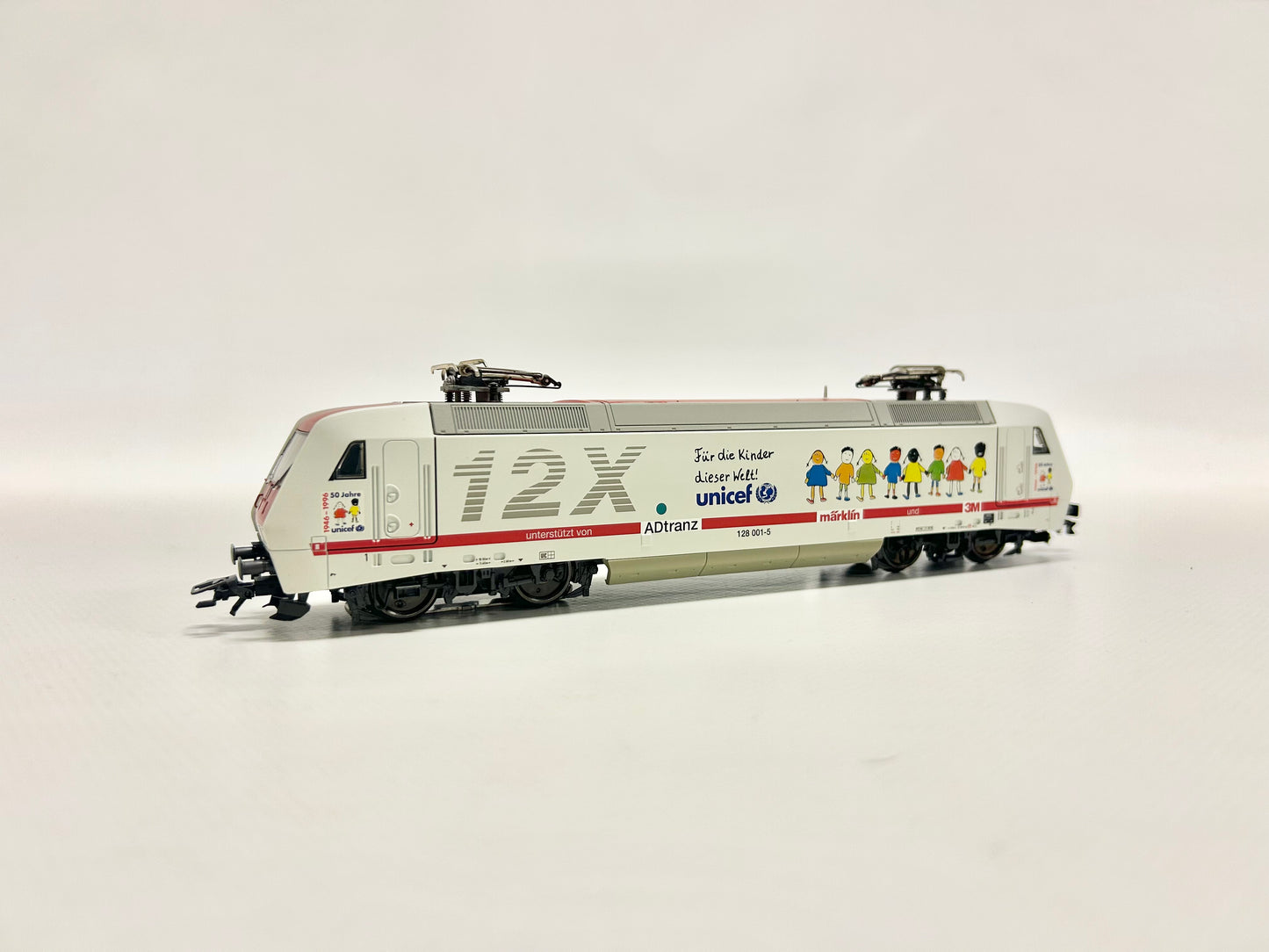 Märklin 34382 Digital Br 128 E-Lok "Unicef" DB H0